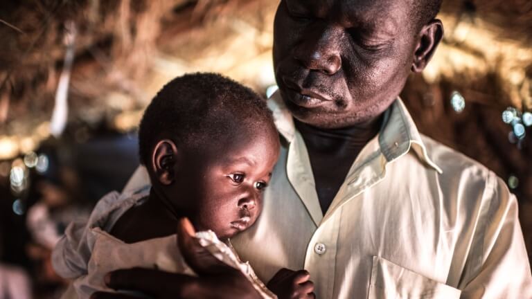 <p>“In Gimono, all of the houses were burned down by soldiers of the government army. Even the food was burnt in the houses. They came in and started shooting. I was so scared.” Justin Malis and little Flora fled from southern Sudan to the refugee camp Bidi Bidi in Uganda.</p>
